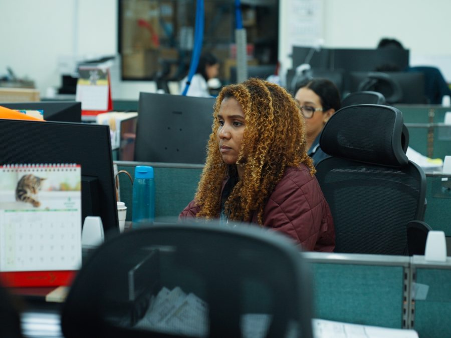 Ashram Logistics administrative team coordinating operations from the office