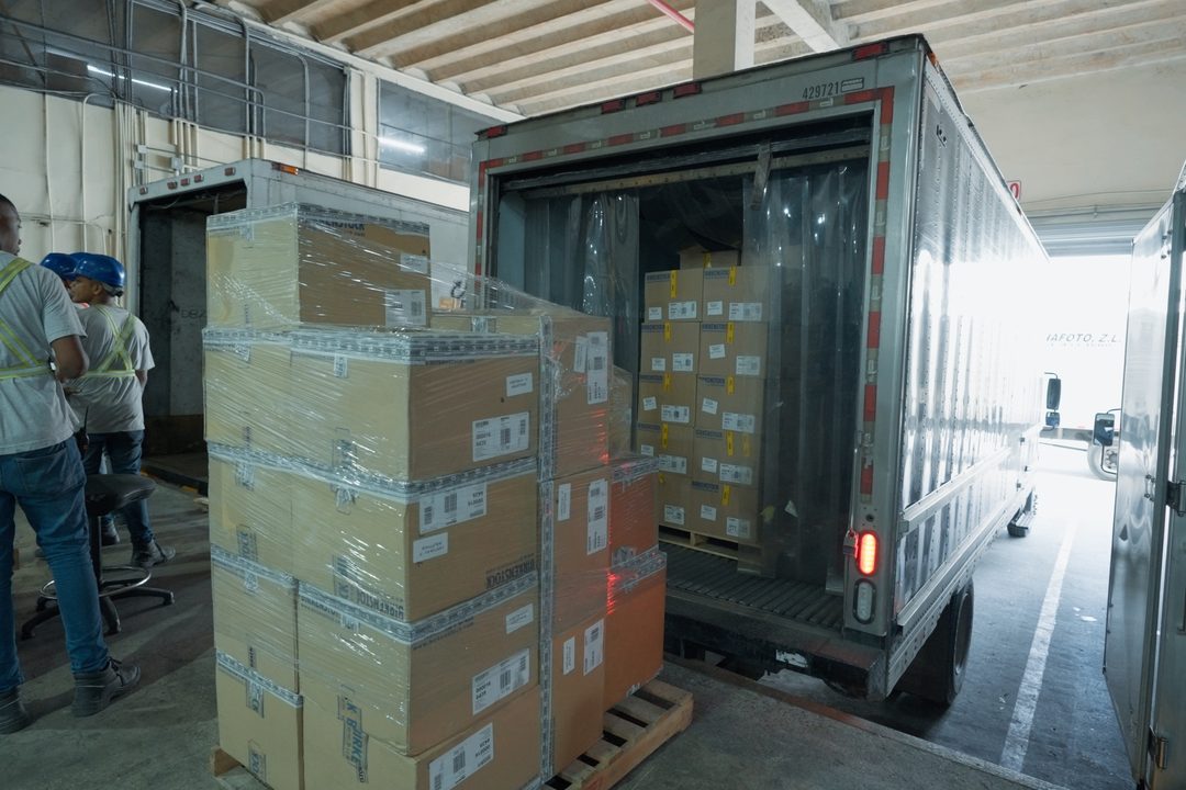 Consolidated pallets of goods being loaded onto a truck