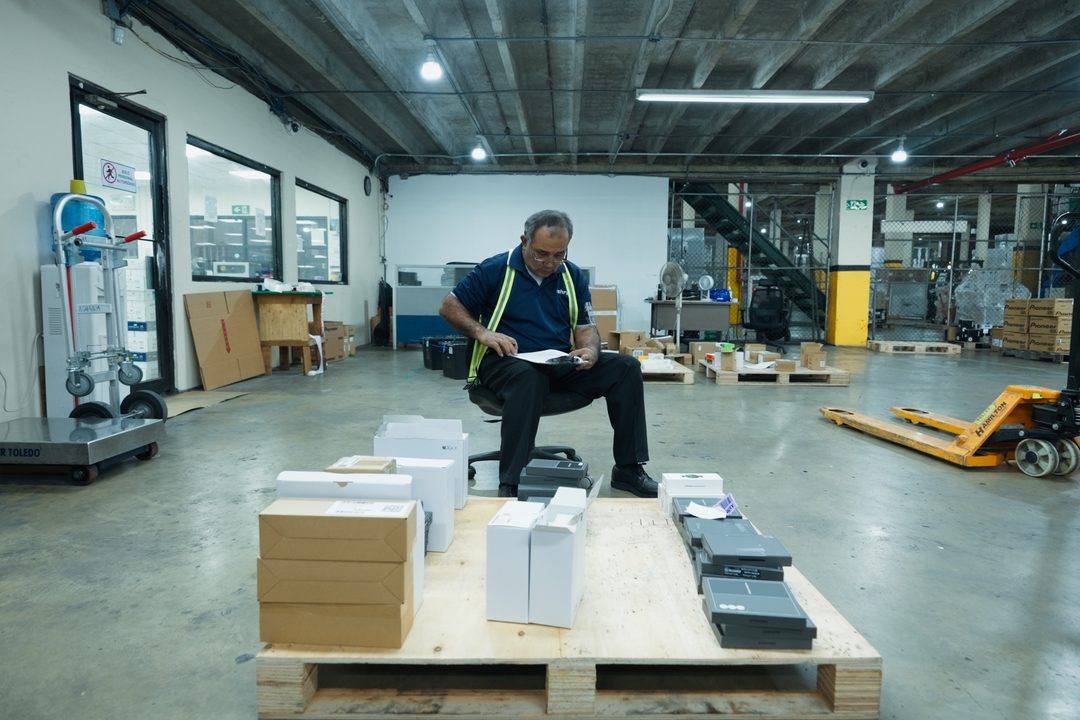 Team member preparing and checking products on a pallet